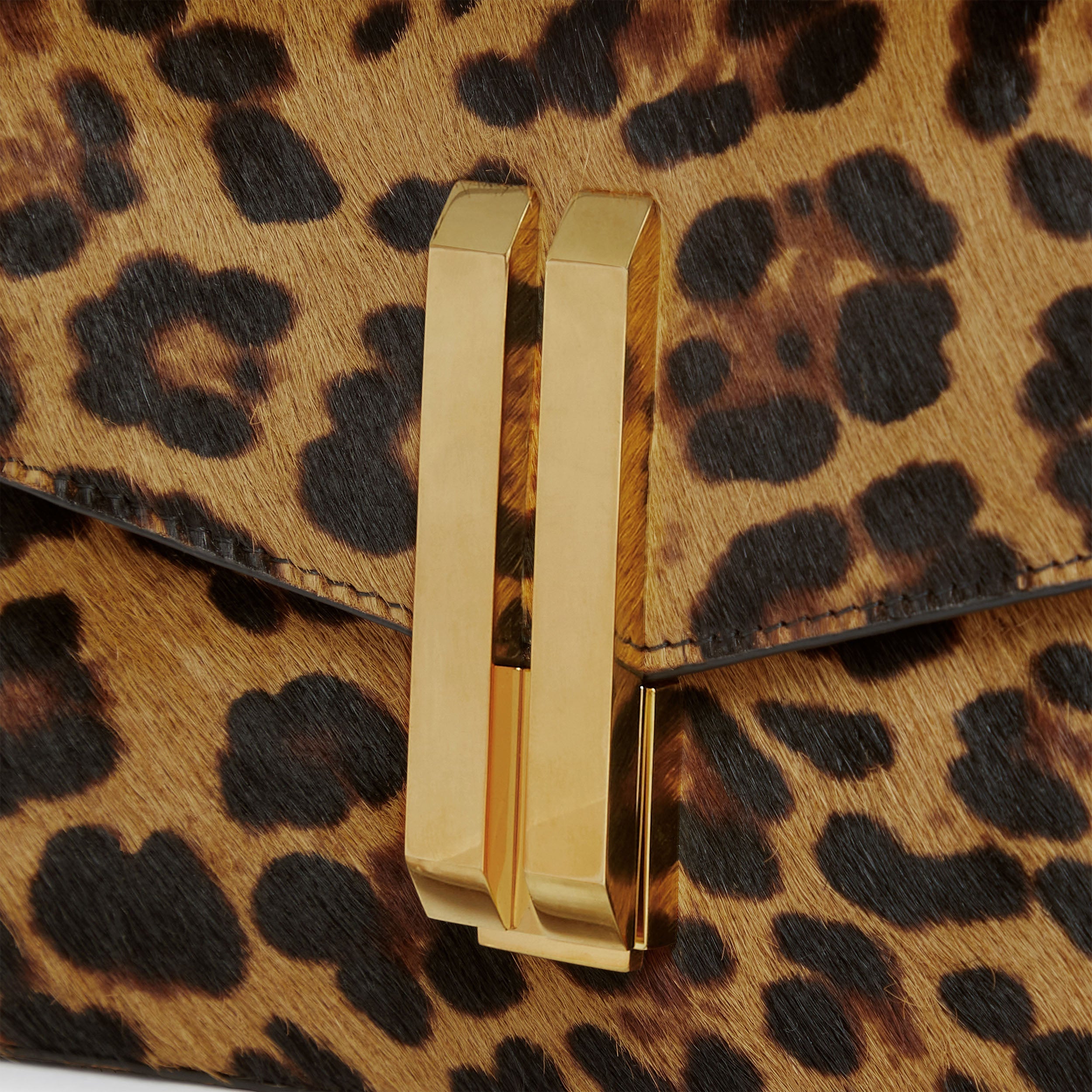 The Vancouver Clutch - leopard-effect calf hair & black smooth